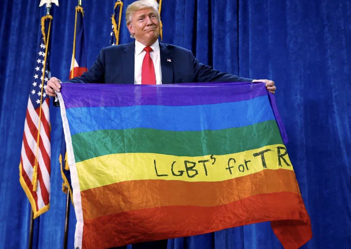 Holding an LGBTs for TR flag
